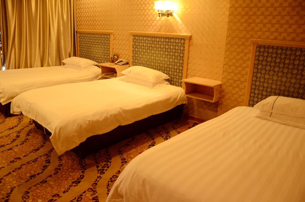 Omeiga Business Hotel Yiwu (Zhejiang) Quarto foto