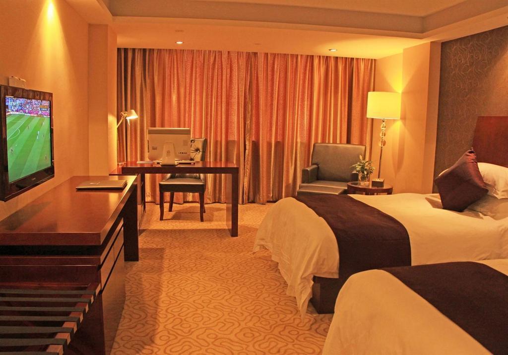 Omeiga Business Hotel Yiwu (Zhejiang) Quarto foto